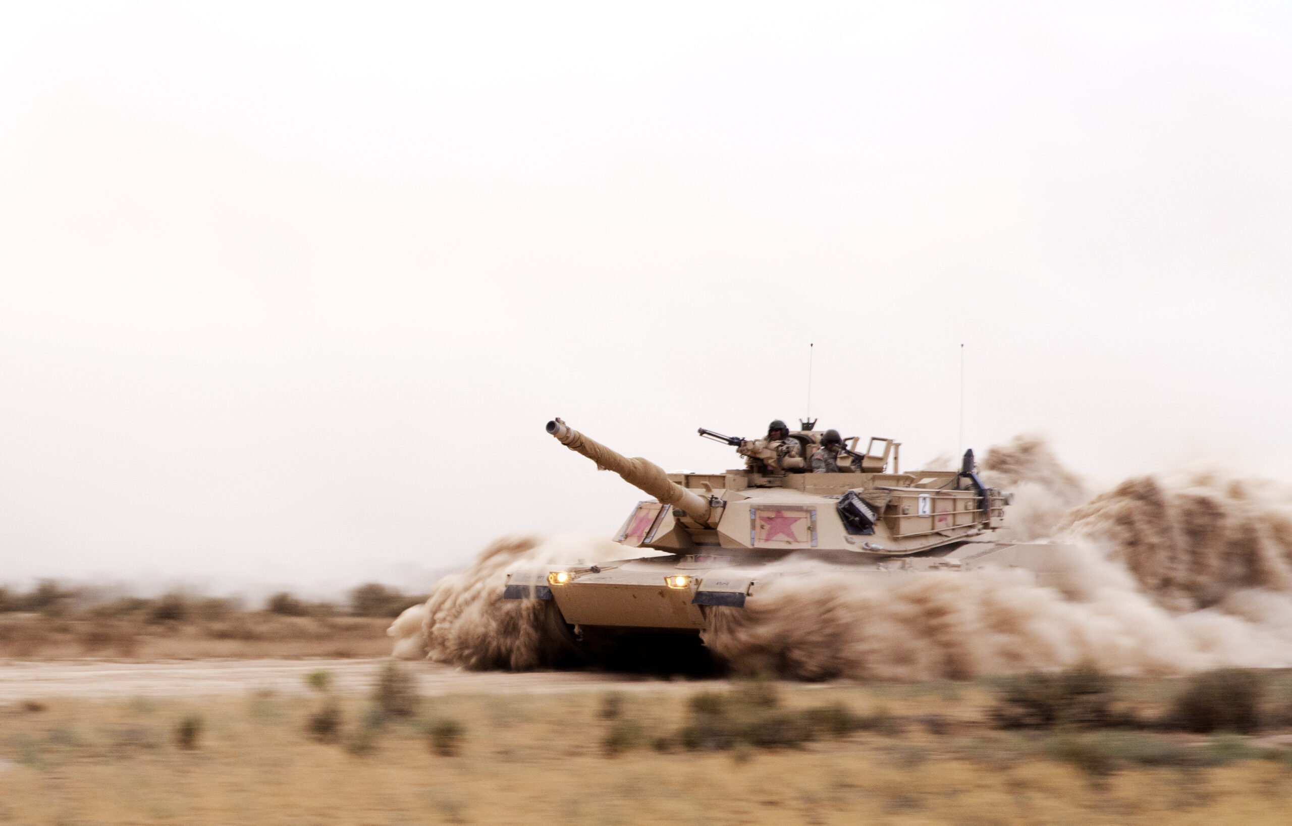 An Abrams M1A1 Tank and its crew with the Minnesota Army National Guard plows through thick dusty roads at the Orchard Training Center, Idaho during tank maneuver engagement training for the 3rd Battalion, 116th Heavy Brigade Combat Team Aug. 20. Members of the the Minnesota Army National Guard acted as enemy forces to support the Oregon Army National Guard armor unit's annual training where they were tasked with qualifying their mortar, mounted infantry and armored units in movement and live fire exercises. (U.S. Army photo by 1st Sgt. Kevin Hartman, 115 Mobile Public Affairs Detachment, Oregon Army National Guard)