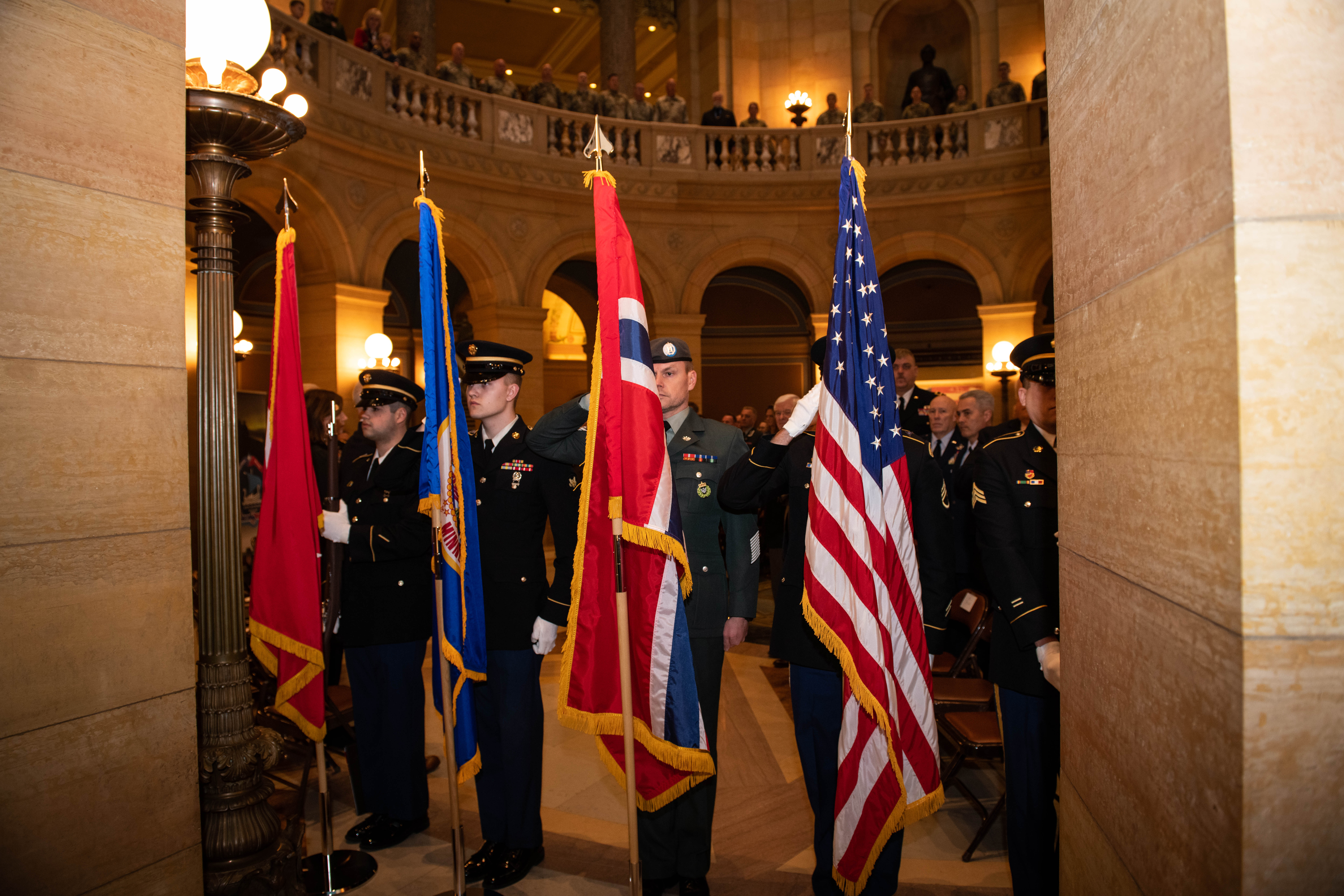 A joint color guard with members of the Minensota National Guard and the Norwegian Home Guard present the colors at the State Partnership Program Letter of Intent signing ceremony hosted by the Minnesota National Guard at the Minnesota State Capitol on Feb. 4, 2023, in St. Paul, Minnesota. The official State Partnership Program signing ceremony is scheduled for Feb.15 in Trondheim, Norway.  



The Department of Defense’s State Partnership Program pairs the National Guard of a U.S. state or territory with a partner nation’s military, security forces, and government agencies responsible for emergency response and disaster response and began in 1993 with 13 partners.  



The Minnesota Guard has shared a partnership with Croatia for 27 years, and Norway will become another partner through this program. (Minnesota National Guard photo by Staff Sgt. Luther Talks)